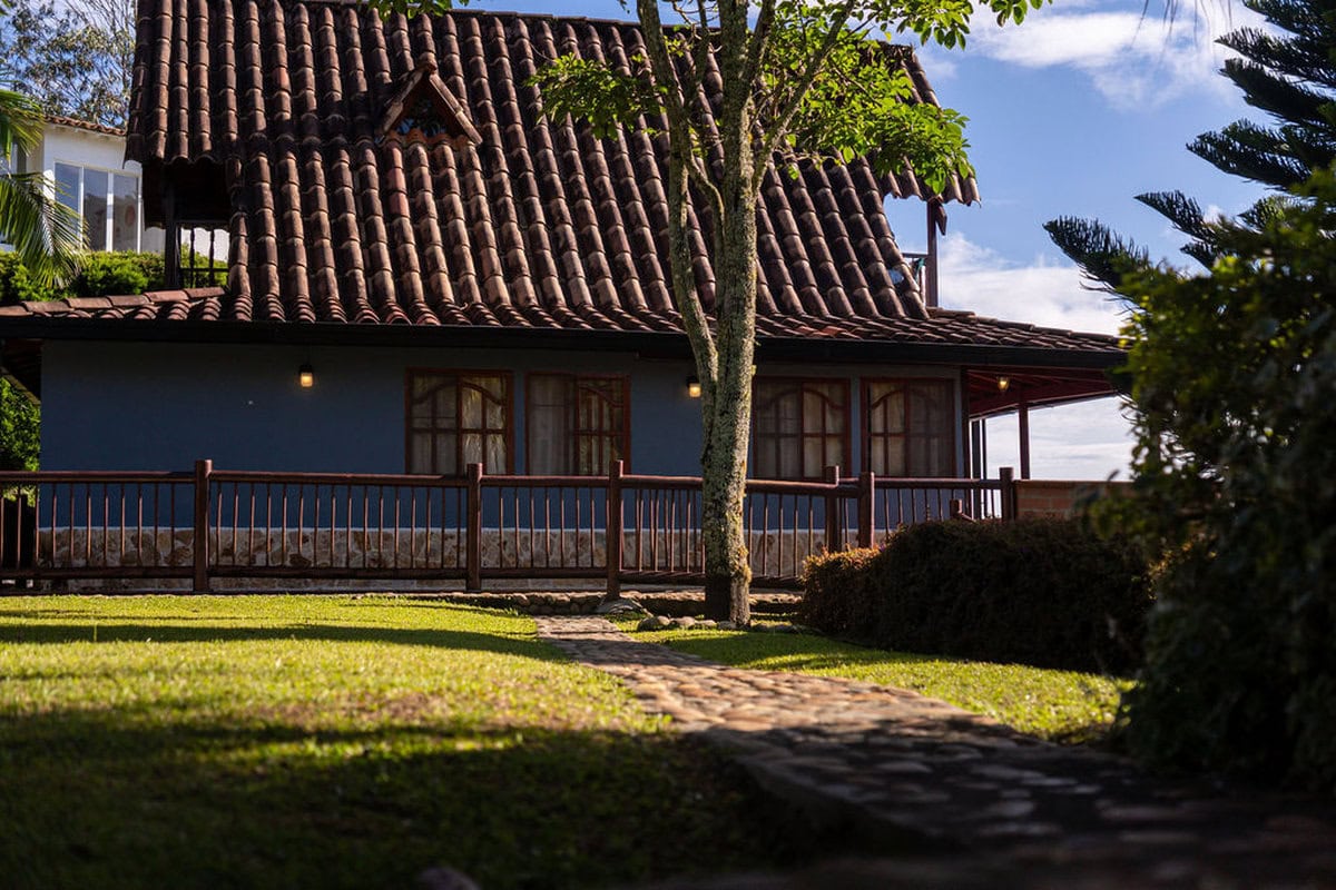 Modern kitchen with mountain-view windows at Finca Conejo Blanco luxury rental