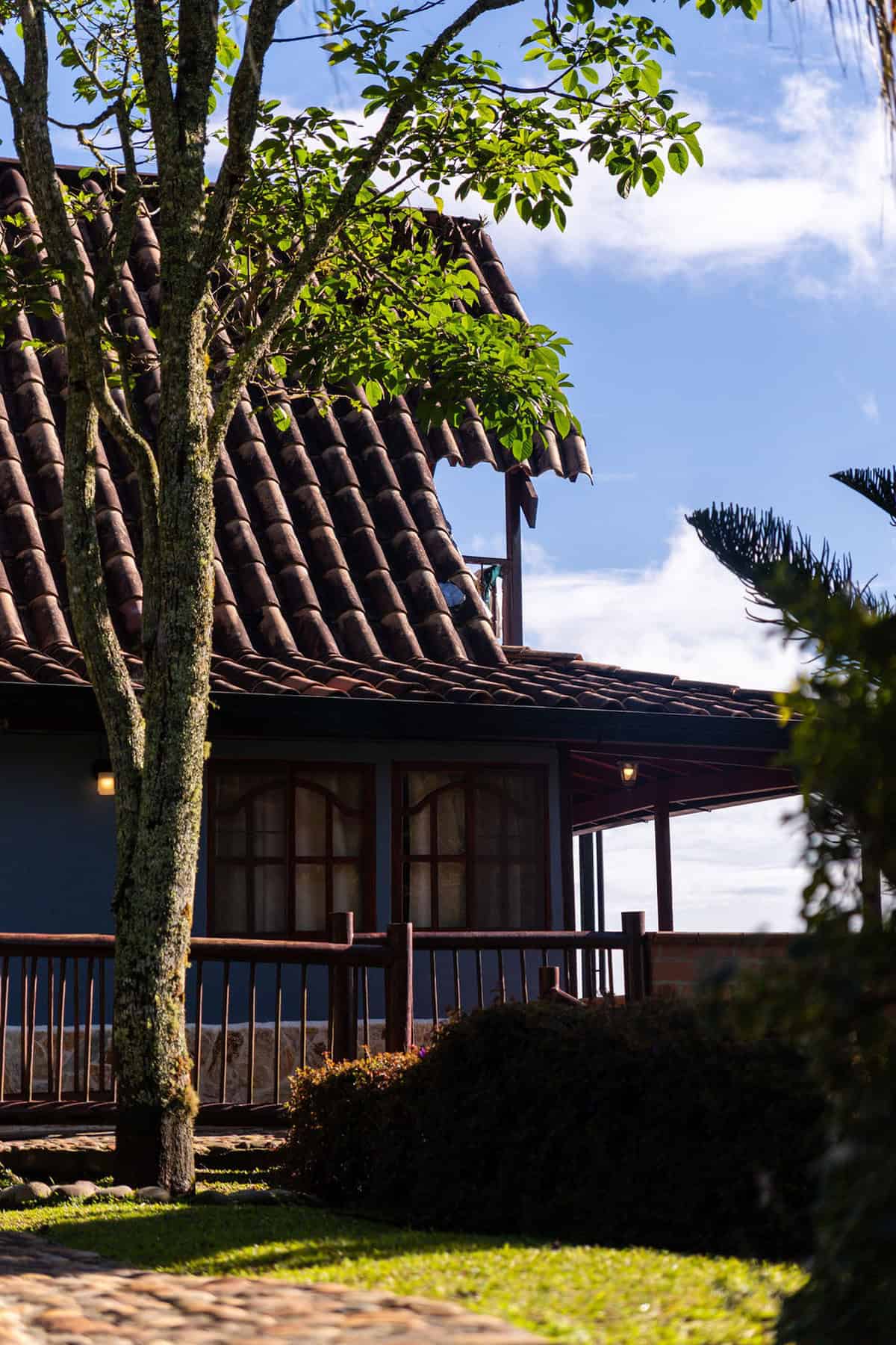 Spacious living room with fireplace at Finca Conejo Blanco countryside estate