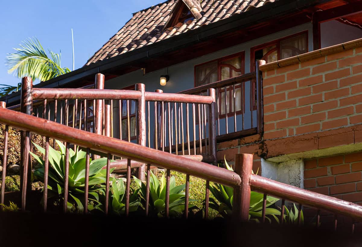 Wooden balcony with views of Guatape Rock at boutique vacation rental