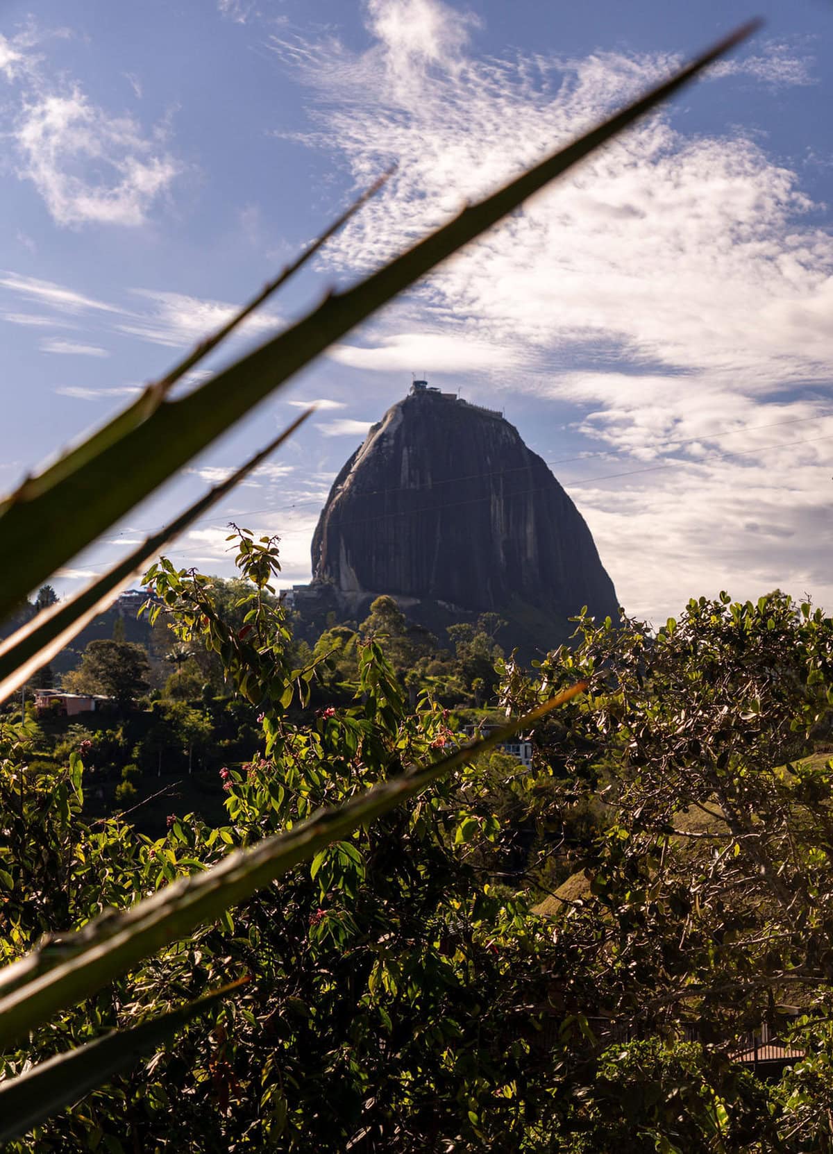 Private outdoor jacuzzi with panoramic views of Guatape Rock at Finca Conejo Blanco luxury vacation rental