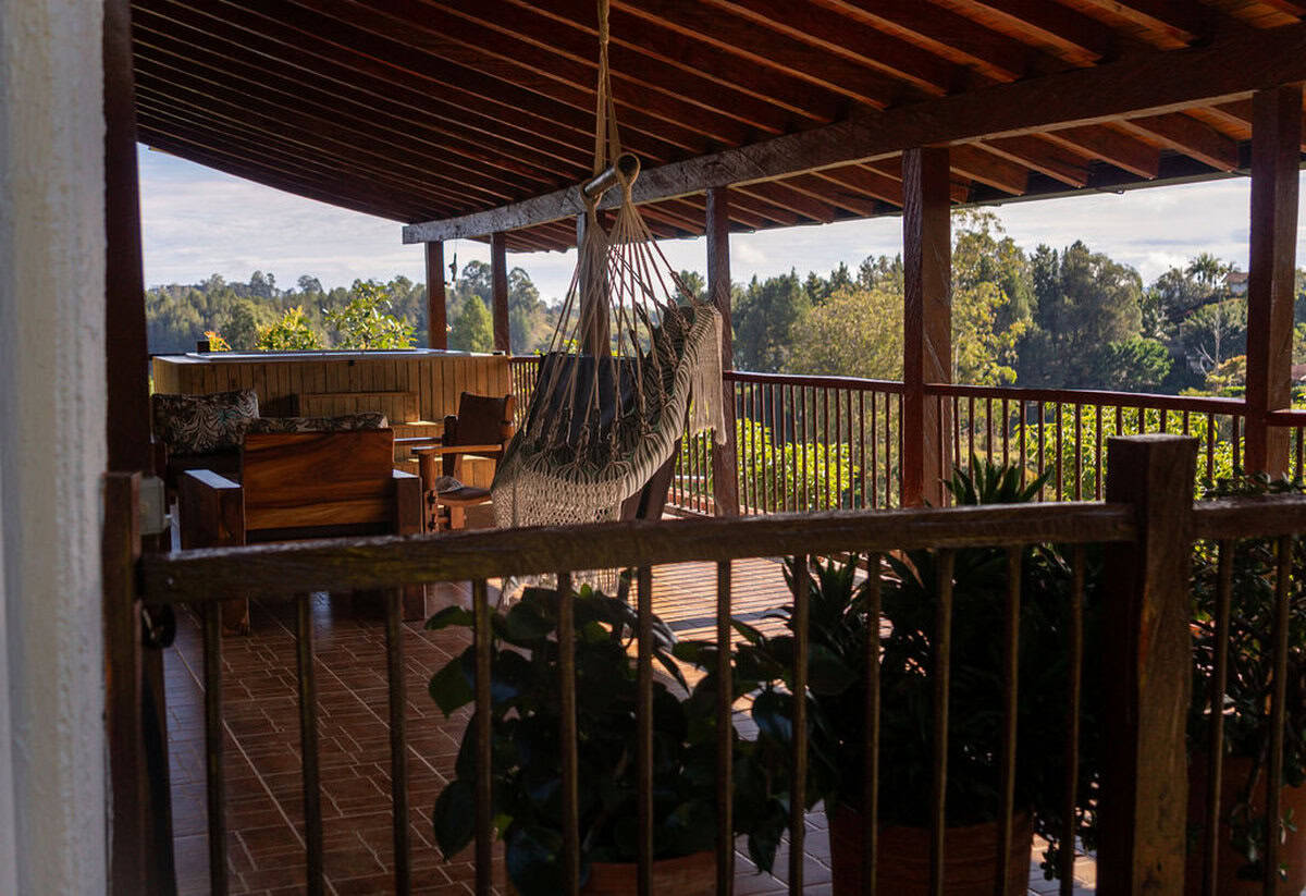 Heated jacuzzi overlooking Guatape lake and mountains at countryside finca Colombia