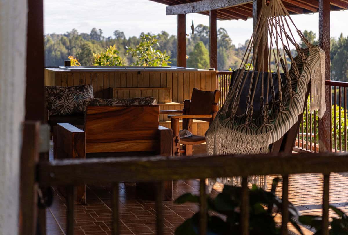 Romantic jacuzzi with sunset views of iconic Peñol Rock at luxury Guatape rental