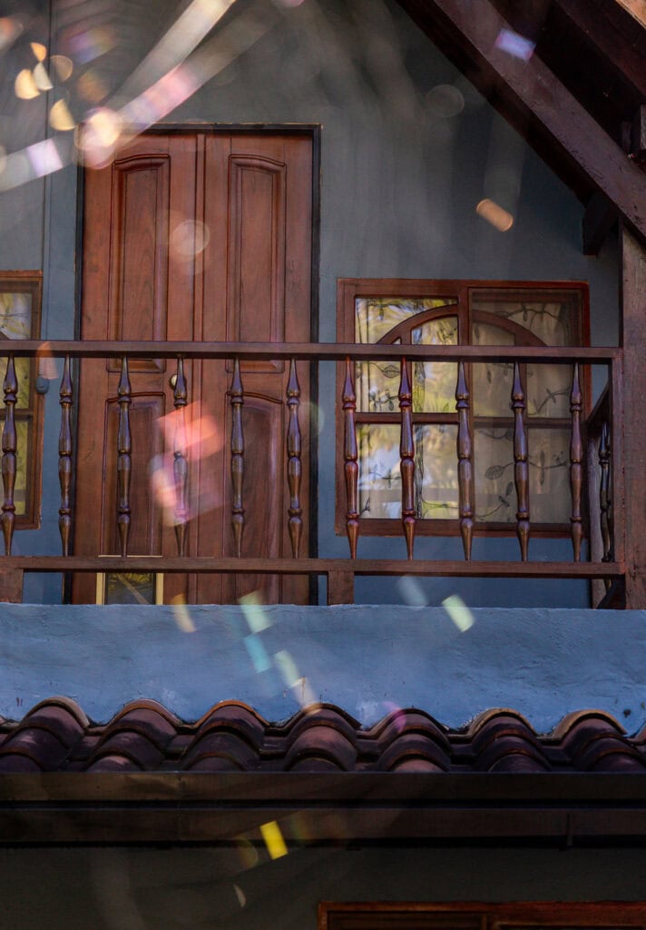 Handcrafted wooden balcony with rustic design at Finca Conejo Blanco resort.