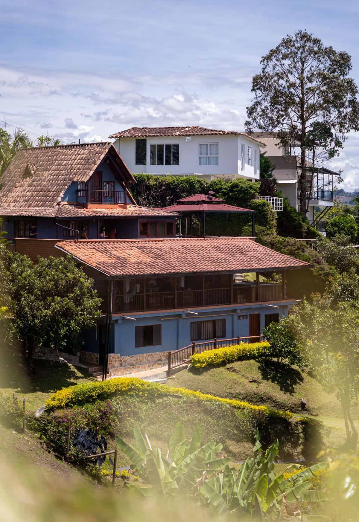 Traditional Colombian finca architecture with mountain backdrop in Guatape Antioquia