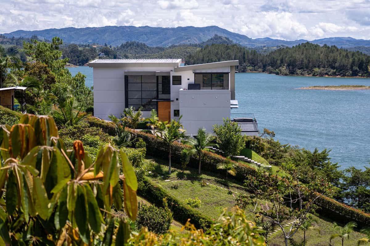Wooden balcony with views of Guatape Rock at boutique vacation rental