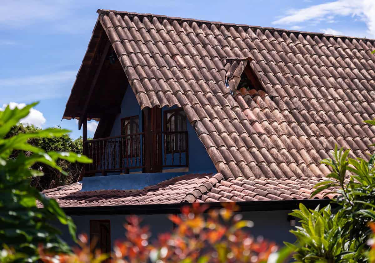 Traditional Colombian finca architecture with mountain backdrop in Guatape Antioquia