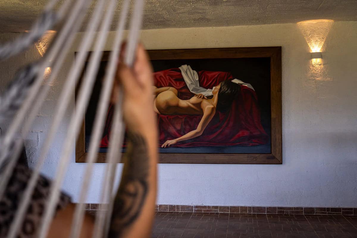 Wooden balcony with views of Guatape Rock at boutique vacation rental