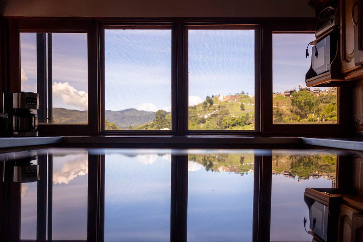 Sunset over Guatape Rock viewed from Finca Conejo Blanco terrace Colombia