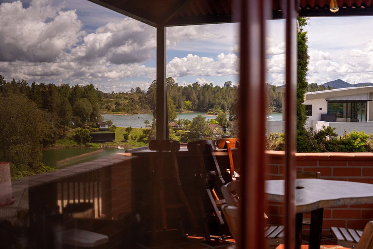 Sunset over Guatape Rock viewed from Finca Conejo Blanco terrace Colombia