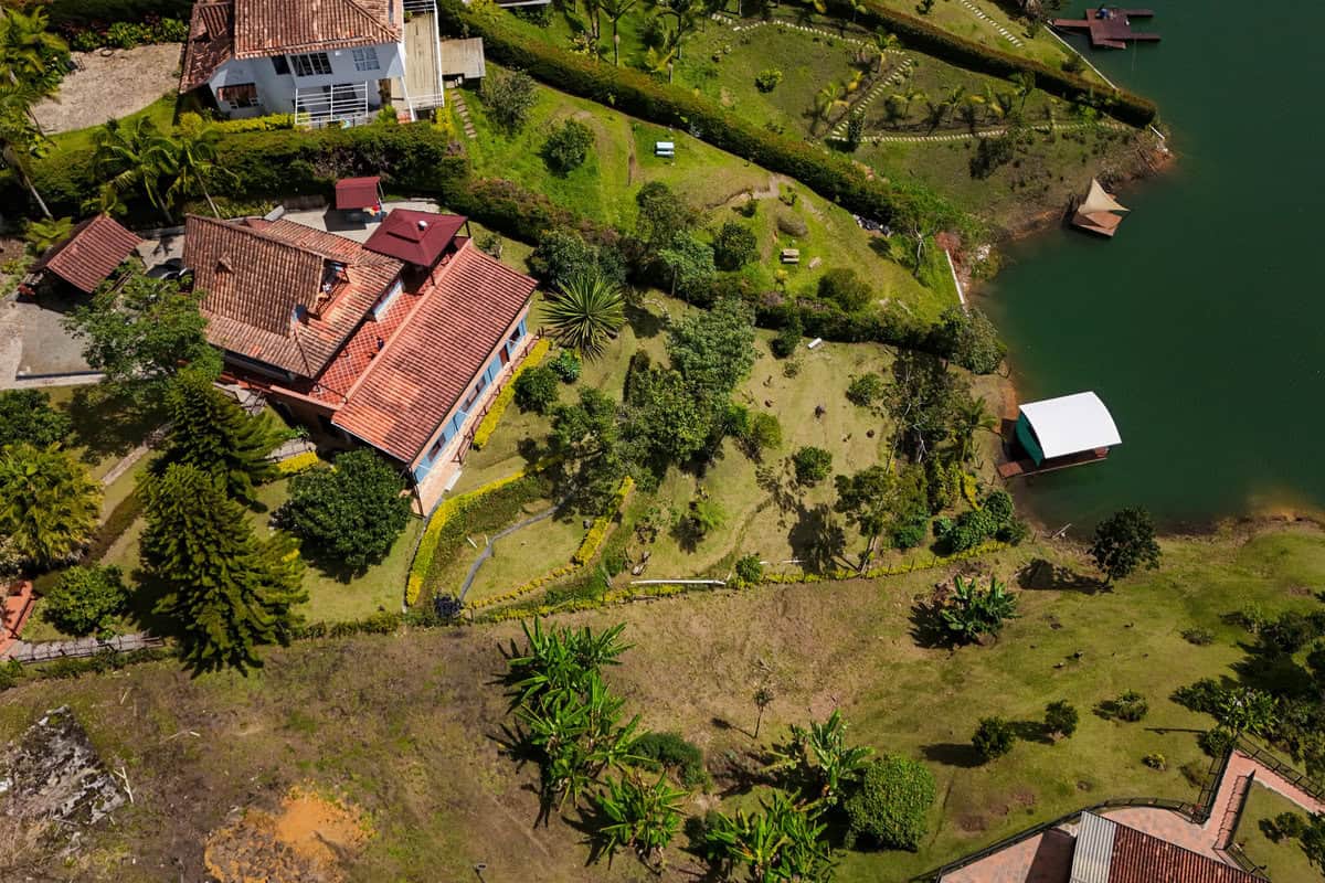 Lush tropical grounds and lake views at Finca Conejo Blanco Costa Rica.