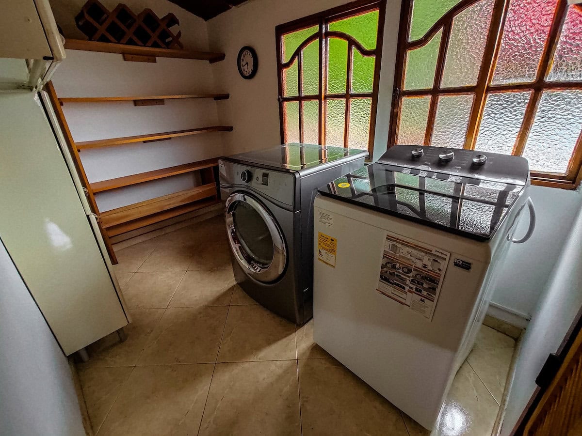 Washer and dryer inside laundry room at Finca Conejo Blanco.
