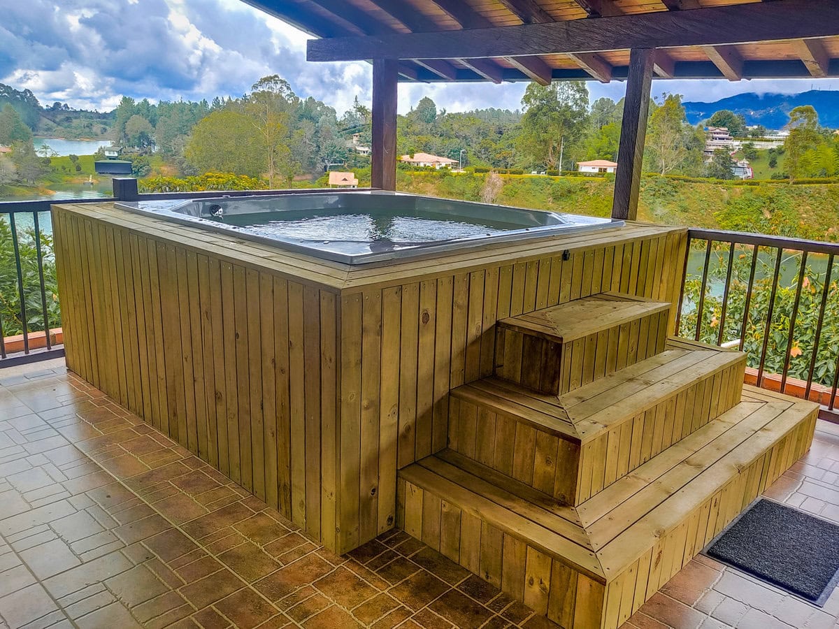 Private outdoor jacuzzi with panoramic views of Guatape Rock